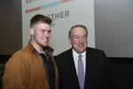 Mike Huckabee Poses for a Picture with an Audience Member